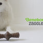 Benebone Zaggler video with music no talking. Video shows dogs interacting with Benebones. Video contains text that reads: Benebone Zaggler. Irresistible real flavors, bacon, peanut butter, chicken. Real pieces of bacon! Paw-friendly grips. Long-lasting fun. Stay playful Benebone logo.